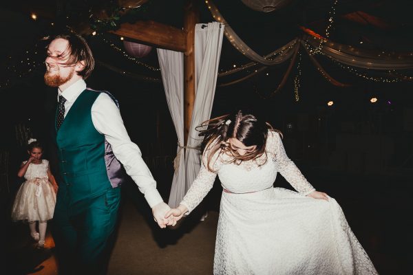 bride and groom enter the dance floor holding hands, styal lodge wedding photography, styal lodge wedding photographer, manchester wedding photographer, manchester wedding photography, cheshire wedding photographer, cheshire wedding photography