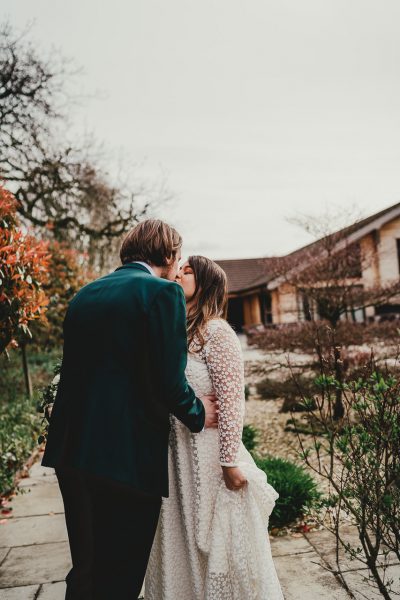 bride and groom have a kiss in a garden, styal lodge wedding photography, styal lodge wedding photographer, manchester wedding photographer, manchester wedding photography, cheshire wedding photographer, cheshire wedding photography