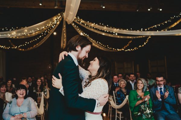 bride and groom embrace each other in front of their guests, styal lodge wedding photography, styal lodge wedding photographer, manchester wedding photographer, manchester wedding photography, cheshire wedding photographer, cheshire wedding photography