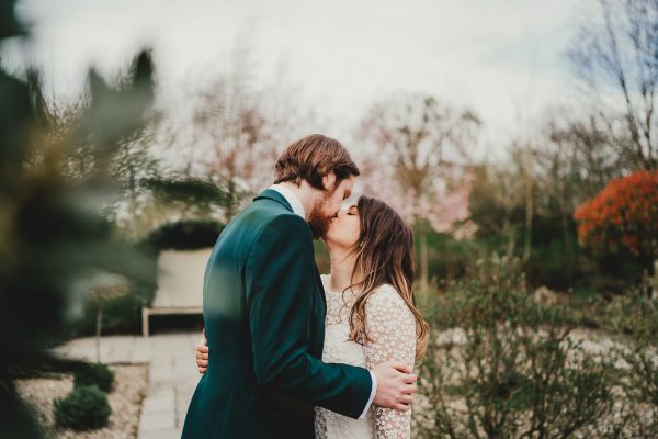 bride and groom kiss in the garden, styal lodge wedding photography, styal lodge wedding photographer, manchester wedding photographer, manchester wedding photography, cheshire wedding photographer, cheshire wedding photography