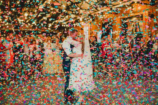 bride and groom dancing with confetti canons going off around them and lots of colourful confetti raining down on them, elsecar heritage centre wedding photographer, elsecar heritage centre wedding photography, elsecar heritage centre wedding, ayesha photographer, manchester wedding photographer, manchester wedding photography, sheffield wedding photographer, sheffield wedding photography, barnsley wedding photographer, innercity weddings