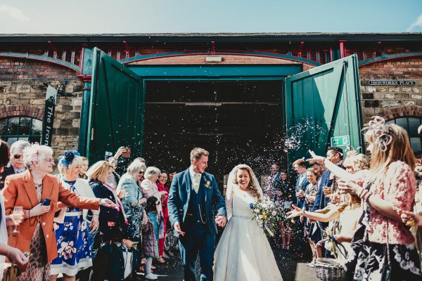 bride and groom exit to guests throwing lots of confetti, elsecar heritage centre wedding photographer, elsecar heritage centre wedding photography, elsecar heritage centre wedding, ayesha photographer, manchester wedding photographer, manchester wedding photography, sheffield wedding photographer, sheffield wedding photography, barnsley wedding photographer, innercity weddings