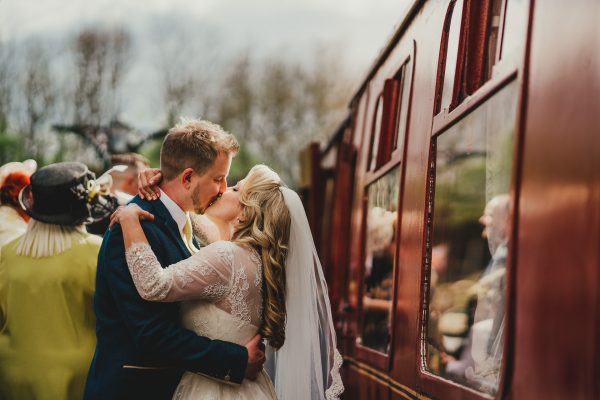 bride and groom kiss on train platform next to the train, elsecar heritage centre wedding photographer, elsecar heritage centre wedding photography, elsecar heritage centre wedding, ayesha photographer, manchester wedding photographer, manchester wedding photography, sheffield wedding photographer, sheffield wedding photography, barnsley wedding photographer, innercity weddings