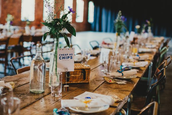 table decorations at a wedding with Cheap as Chips as the table header, elsecar heritage centre wedding photographer, elsecar heritage centre wedding photography, elsecar heritage centre wedding, ayesha photographer, manchester wedding photographer, manchester wedding photography, sheffield wedding photographer, sheffield wedding photography, barnsley wedding photographer, innercity weddings